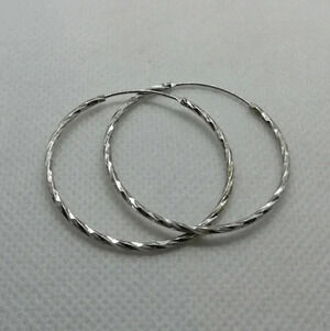 Stunning twist  925 hoops